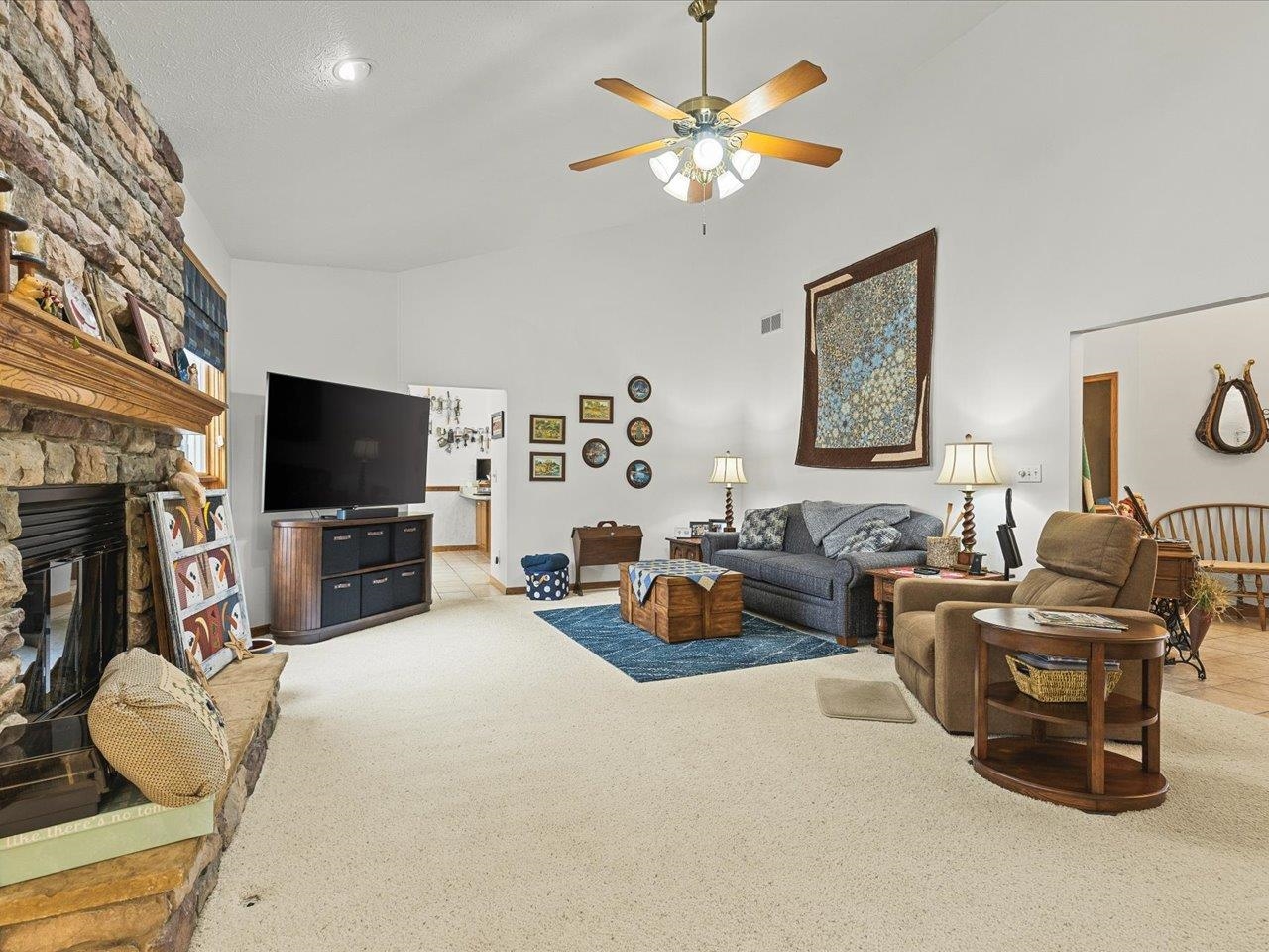 625 Lake Summerset Road Lake Summerset, IL 61019 - Photo 18 of 51 a living room with furniture a flat screen tv and kitchen view