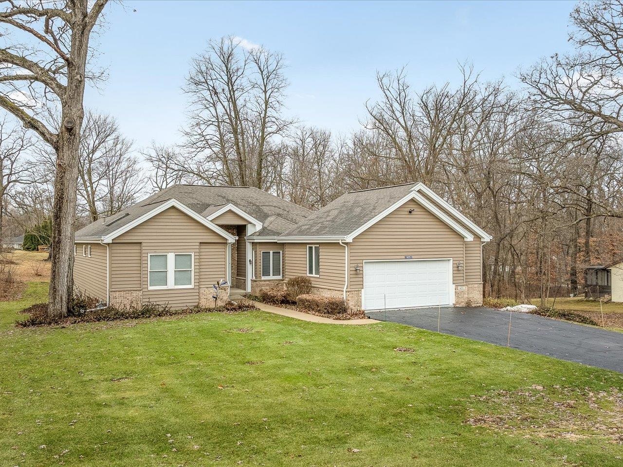 625 Lake Summerset Road Lake Summerset, IL 61019 - Photo 2 of 51 a front view of house with yard and trees around