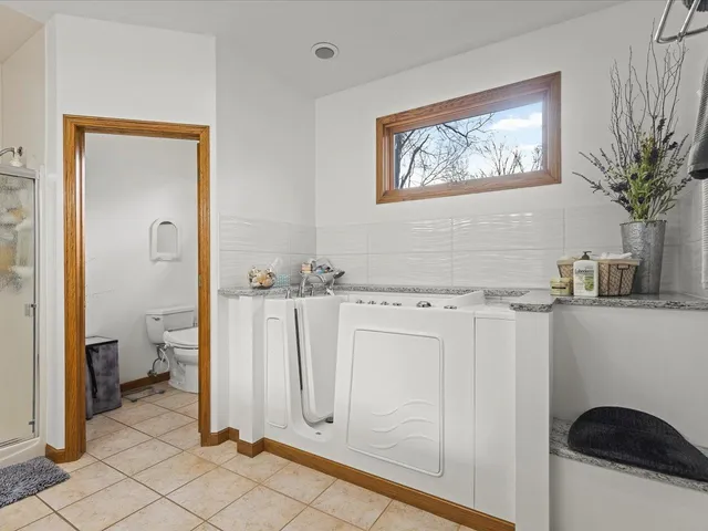 a view of a bathroom with a sink and a shower