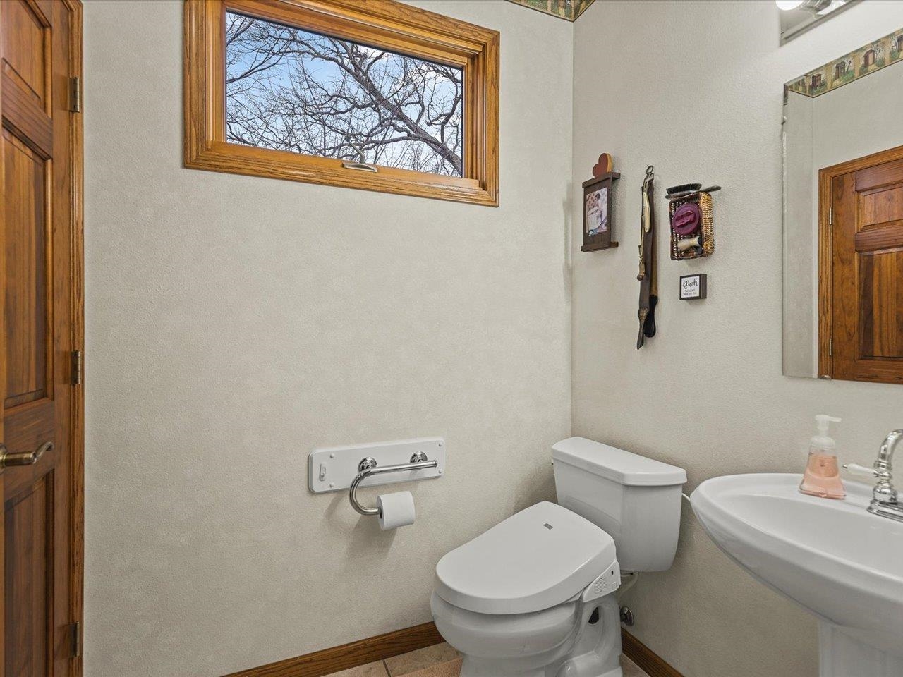 625 Lake Summerset Road Lake Summerset, IL 61019 - Photo 42 of 51 a white toilet sitting next to a bathroom and sink