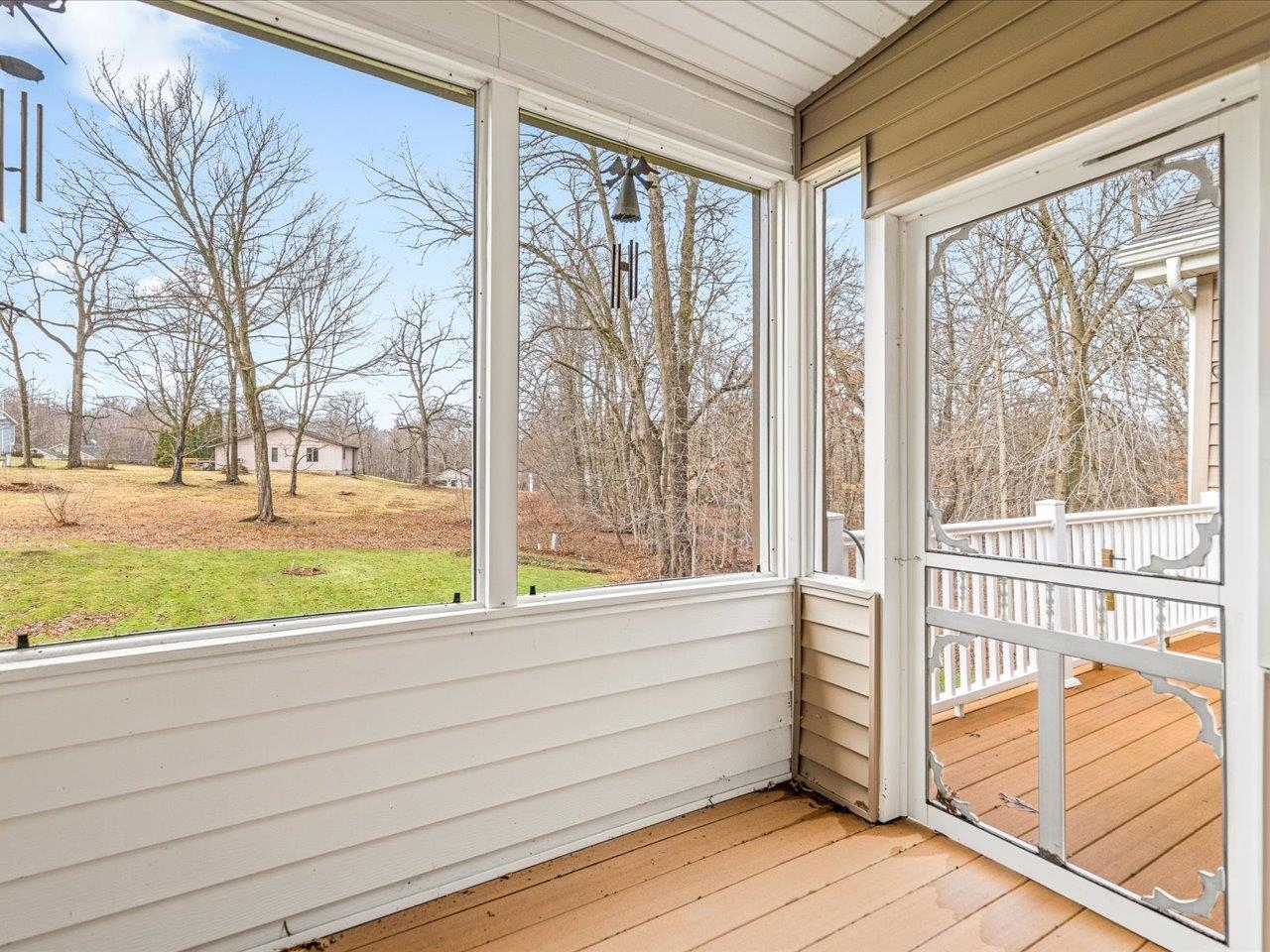 625 Lake Summerset Road Lake Summerset, IL 61019 - Photo 47 of 51 a view of a room with wooden floor and fence