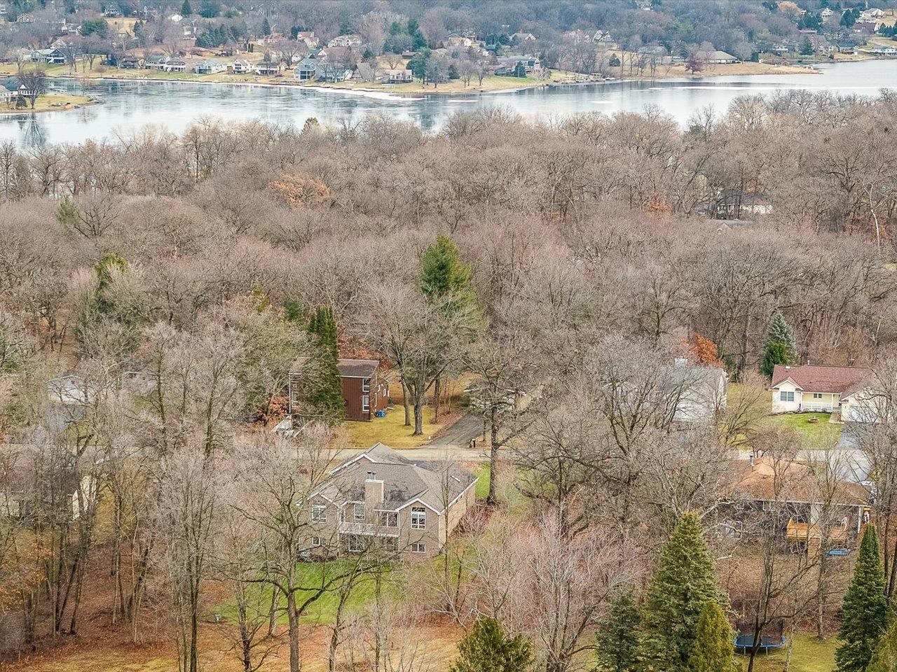 625 Lake Summerset Road Lake Summerset, IL 61019 - Photo 51 of 51 a view of a lake with beach and large trees