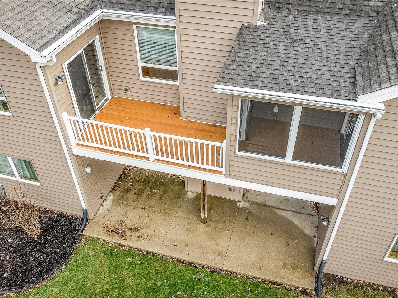 625 Lake Summerset Road Lake Summerset, IL 61019 - Photo 6 of 51 a view of a house with a wooden deck and a yard