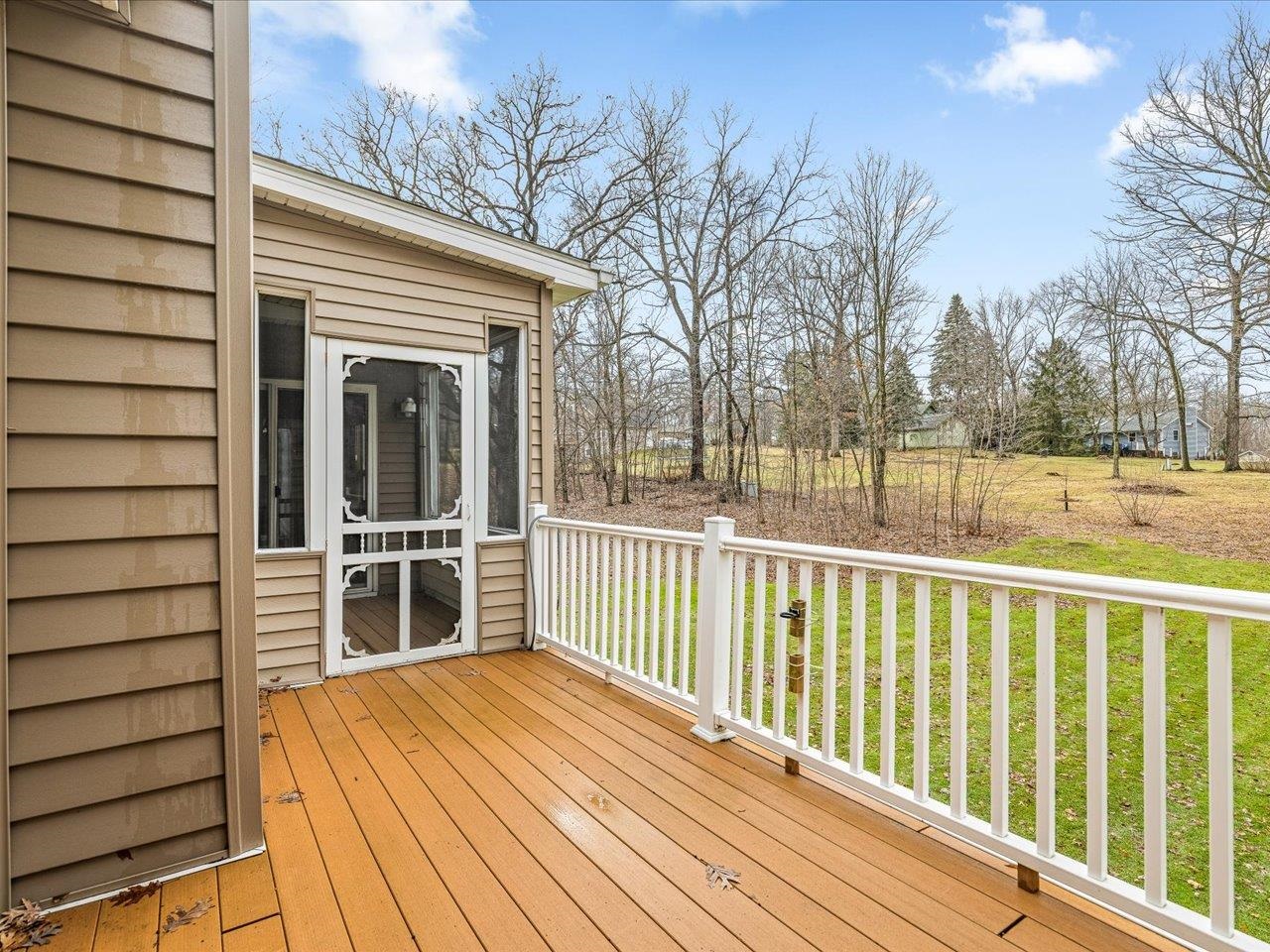 625 Lake Summerset Road Lake Summerset, IL 61019 - Photo 7 of 51 a view of a house with a wooden deck