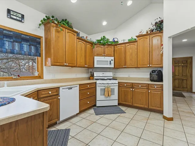 a kitchen with a stove a sink and a refrigerator