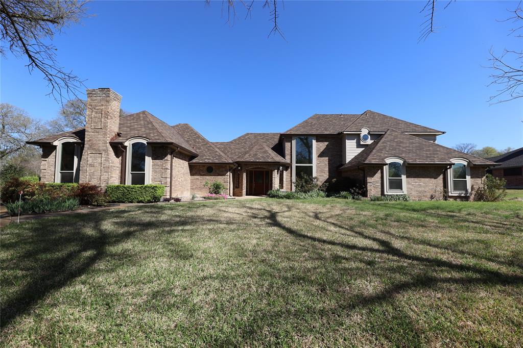 907 Red Oak Creek Road Ovilla, TX 75154 - Photo 1 of 20 a front view of a house with a garden