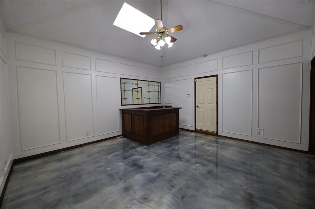 907 Red Oak Creek Road Ovilla, TX 75154 - Photo 11 of 20 a view of an empty room with a chandelier fan