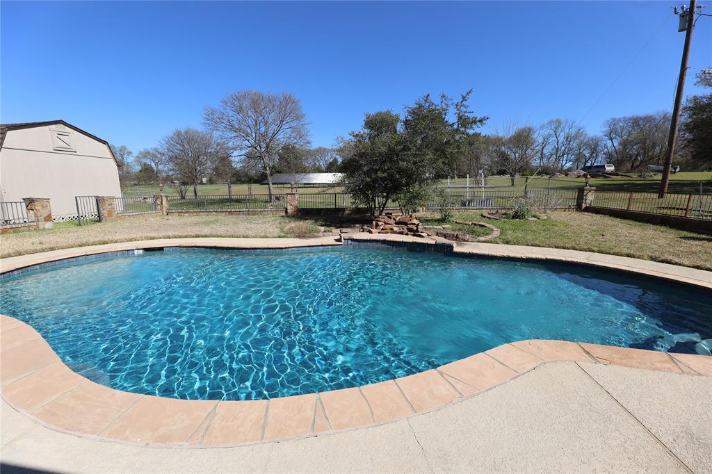 907 Red Oak Creek Road Ovilla, TX 75154 - Photo 3 of 20 a view of a backyard with swimming pool