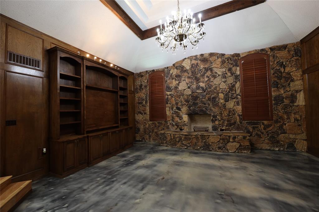907 Red Oak Creek Road Ovilla, TX 75154 - Photo 9 of 20 a living room with fireplace furniture and a flat screen tv