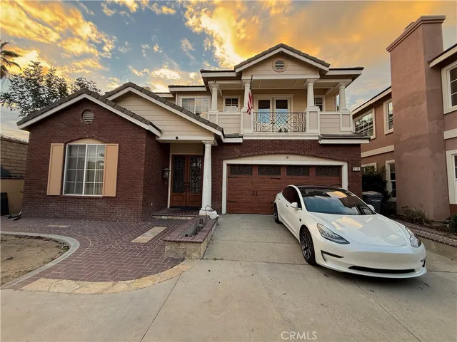 a front view of a house with parking space
