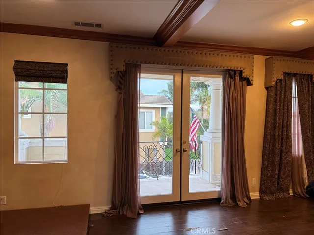 a view of an entryway with wooden floor