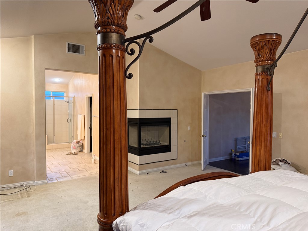 2119 Ridgeview Terrace Drive Signal Hill, CA 90755 - Photo 18 of 22 a bedroom with a bed and a chandelier