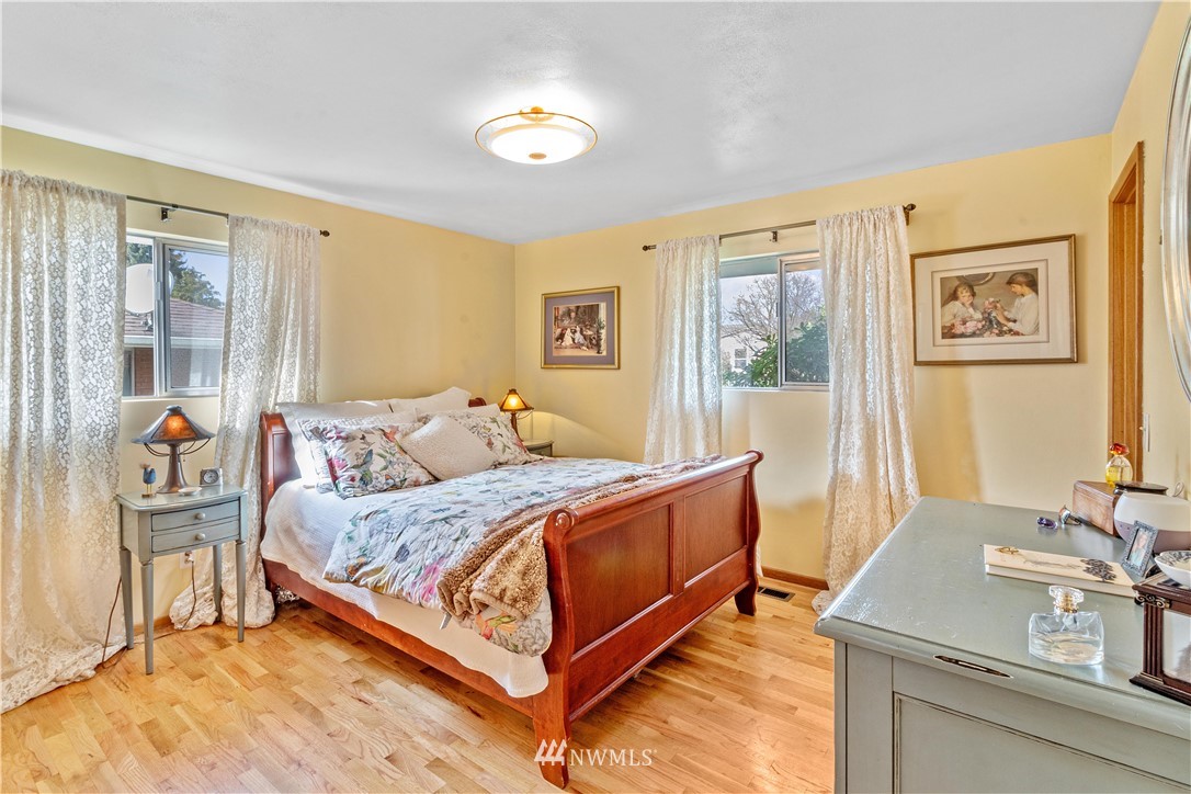 1710 Southwest Gails Avenue Chehalis, WA 98532 - Photo 12 of 24 a bedroom with a bed and a dresser next to a window