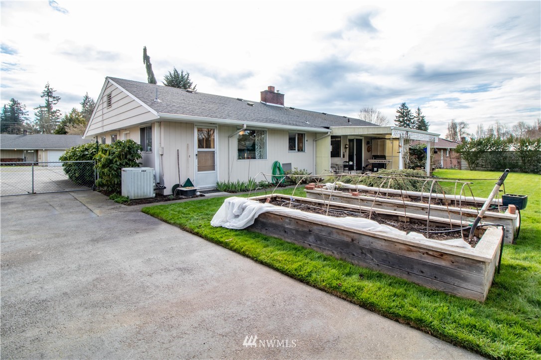 1710 Southwest Gails Avenue Chehalis, WA 98532 - Photo 22 of 24 a front view of a house with a yard table and chairs