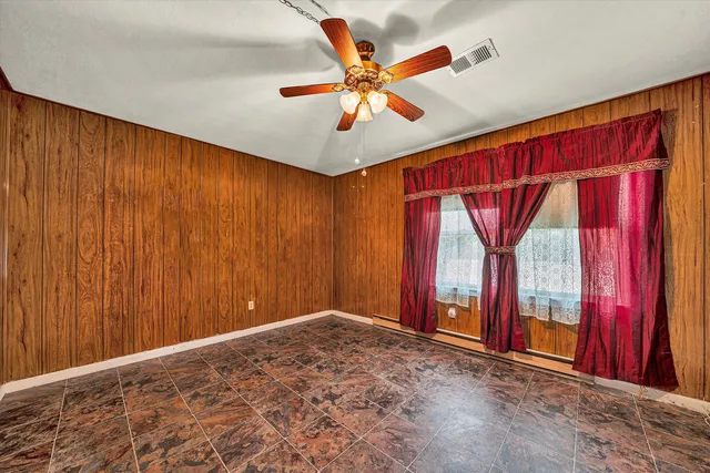 a view of entryway with wooden walls