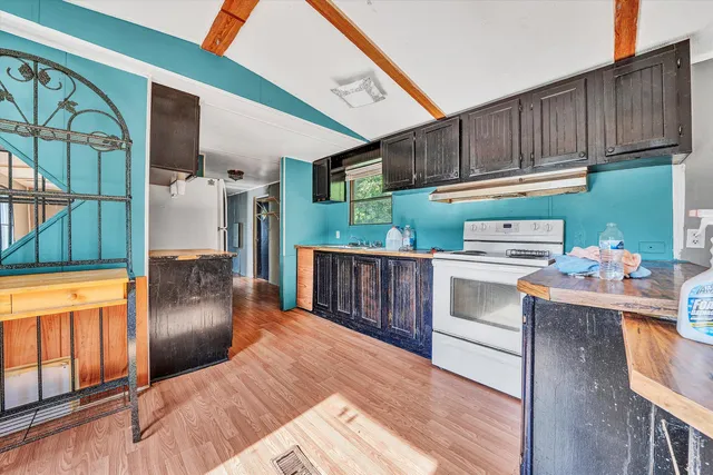 a bathroom with a sink and mirror with bathtub