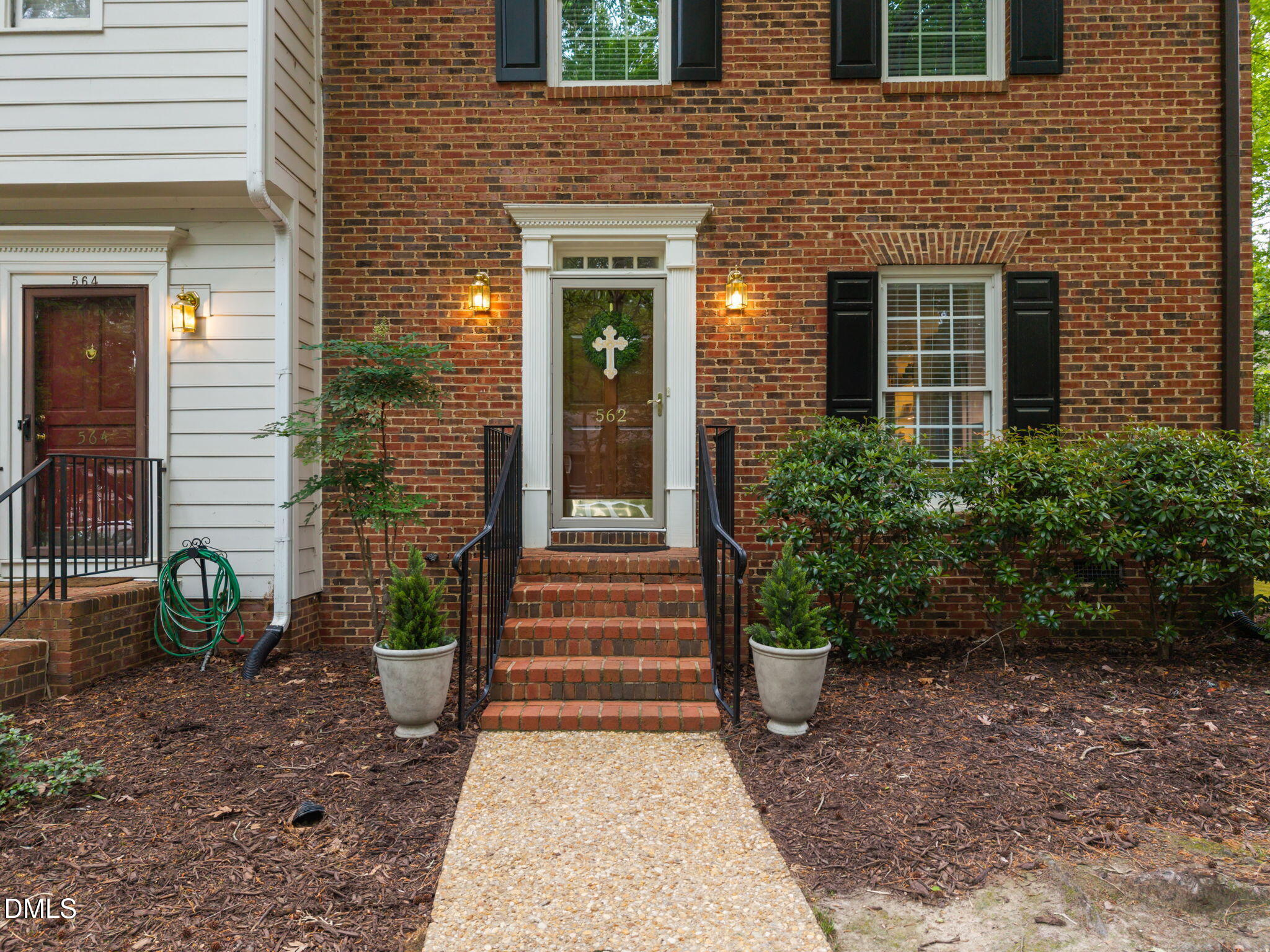 562 Weathergreen Drive Raleigh, NC 27615 - Photo 4 of 47 a view of a house with potted plants