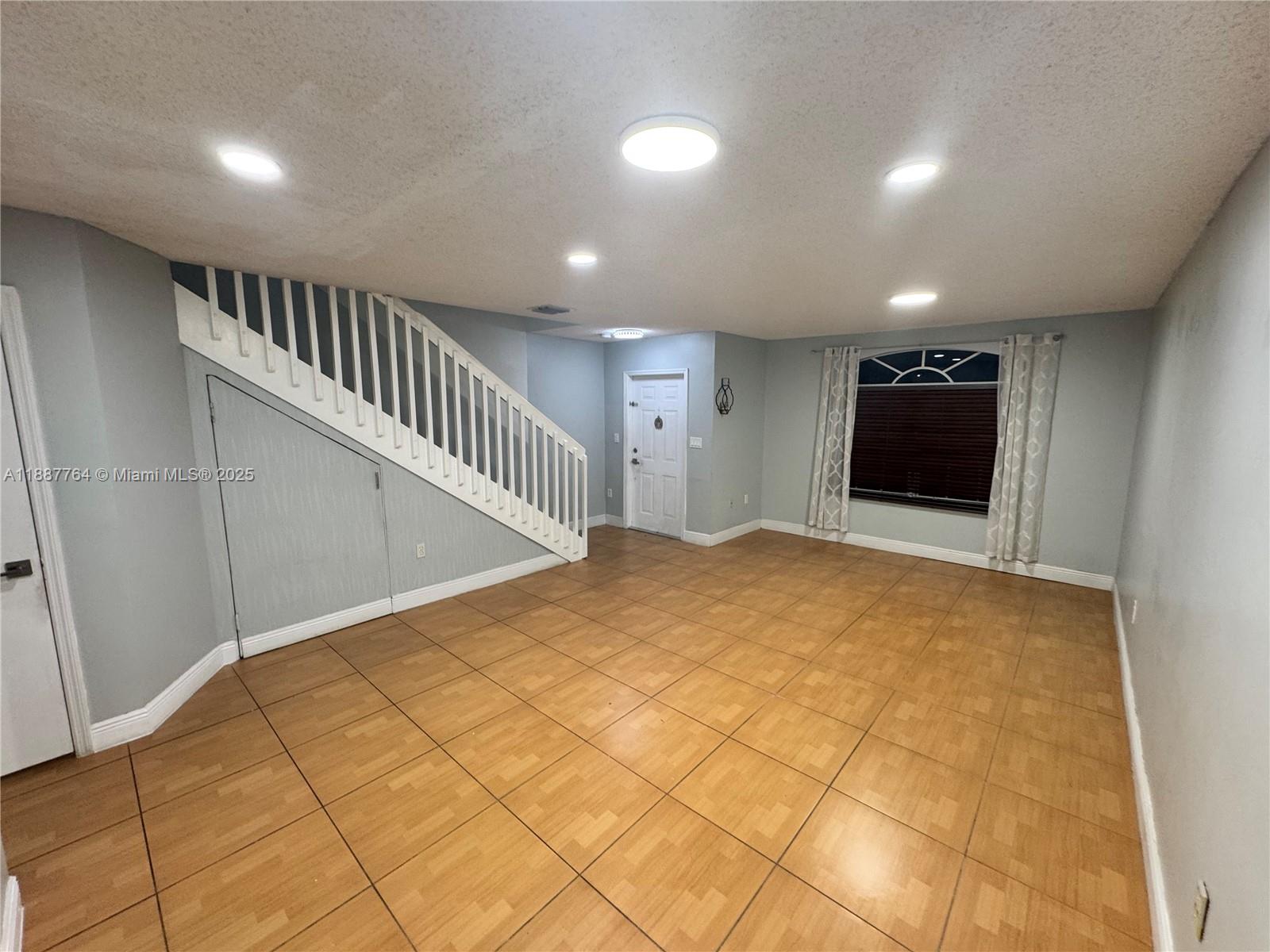 7005 Northwest 173rd Drive, Unit 1702 Hialeah, FL 33015 - Photo 4 of 17 Living room