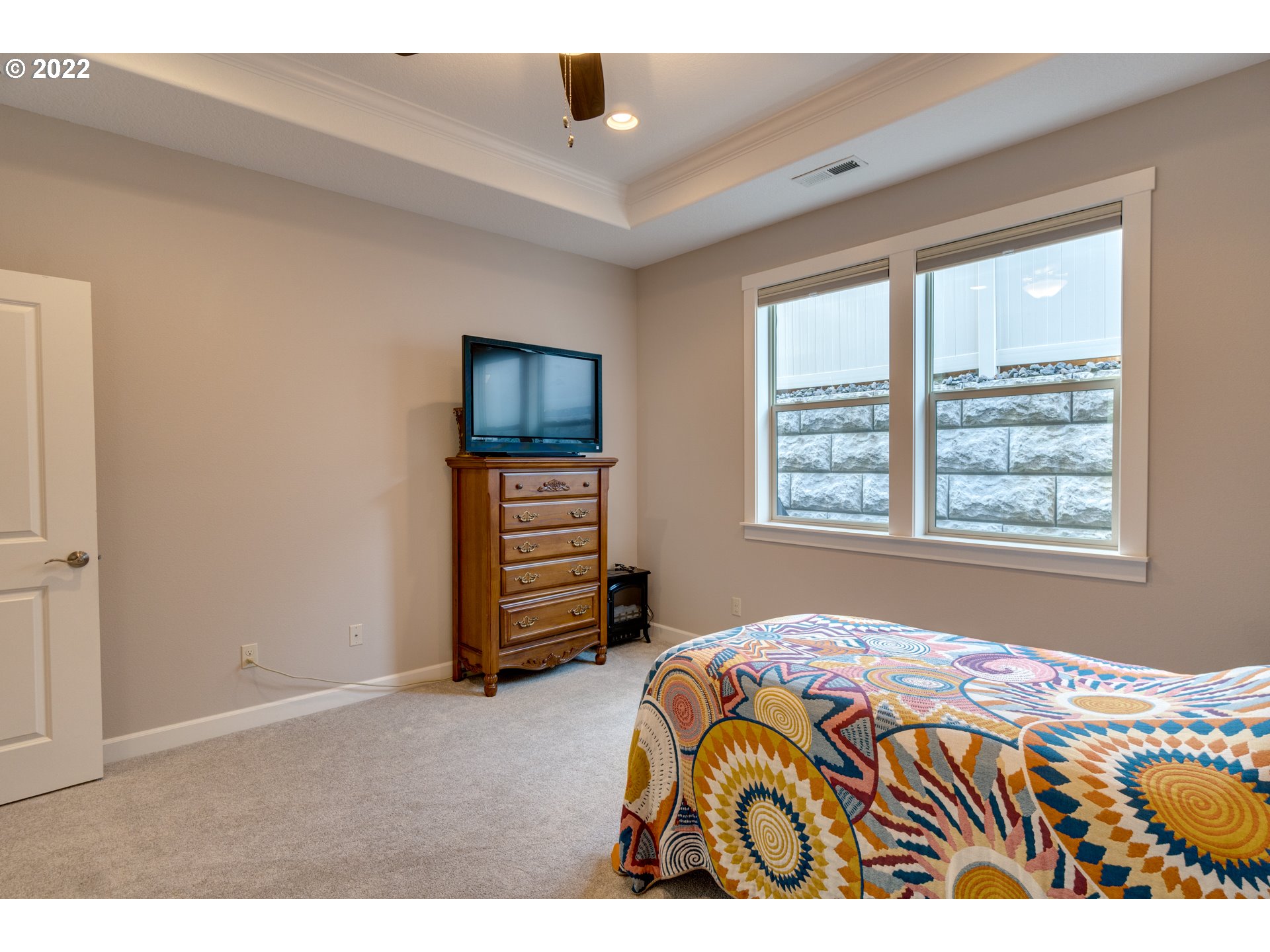 17328 Northeast 16th Avenue Ridgefield, WA 98642 - Photo 21 of 32 a bedroom with a bed and a television