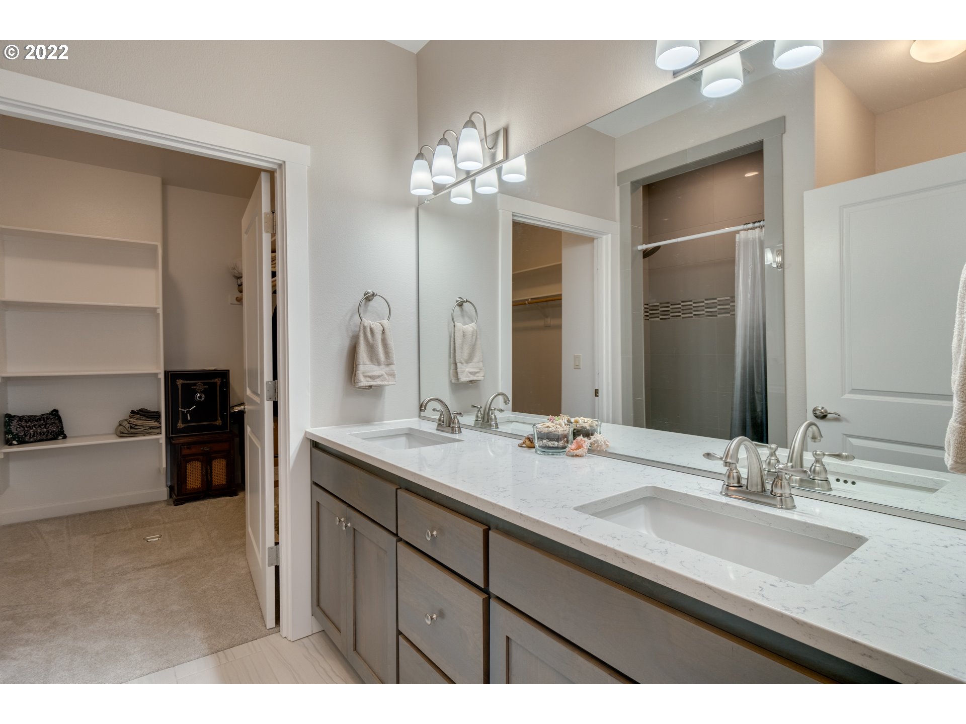 17328 Northeast 16th Avenue Ridgefield, WA 98642 - Photo 24 of 32 a bathroom with a double vanity sink and a mirror