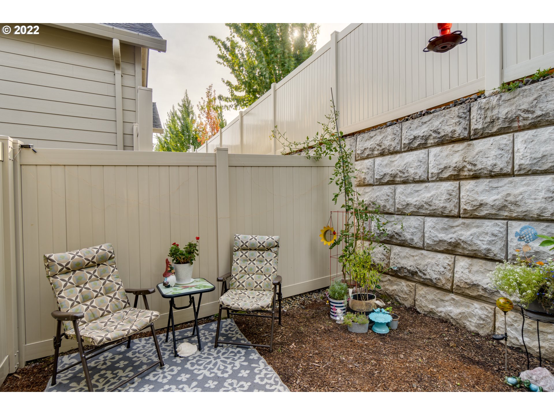 17328 Northeast 16th Avenue Ridgefield, WA 98642 - Photo 28 of 32 a backyard of a house with table and chairs