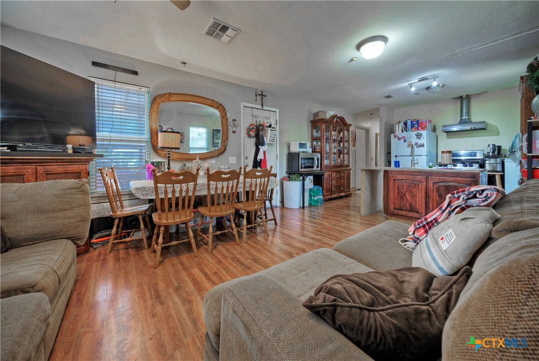 604 Vargas Road Austin, TX 78741 - Photo 12 of 25 a living room with furniture and a wooden floor