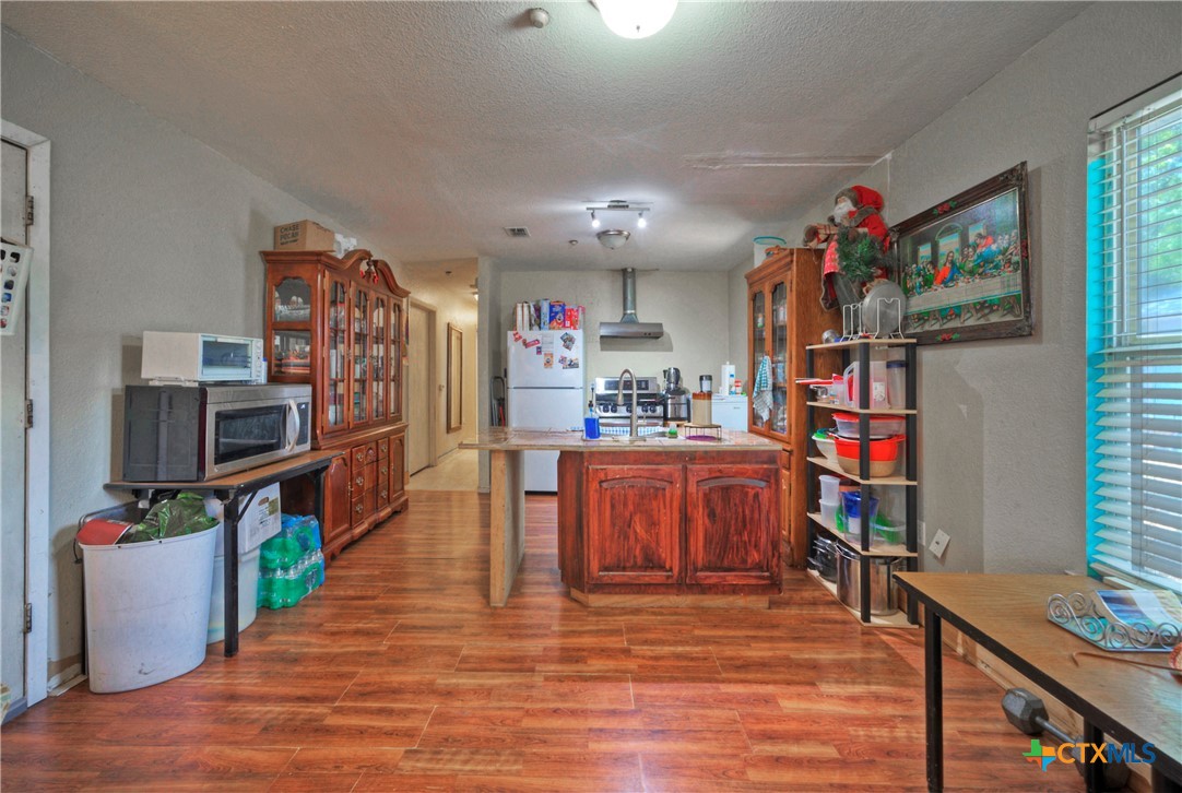604 Vargas Road Austin, TX 78741 - Photo 14 of 25 a living room with furniture and a wooden floor
