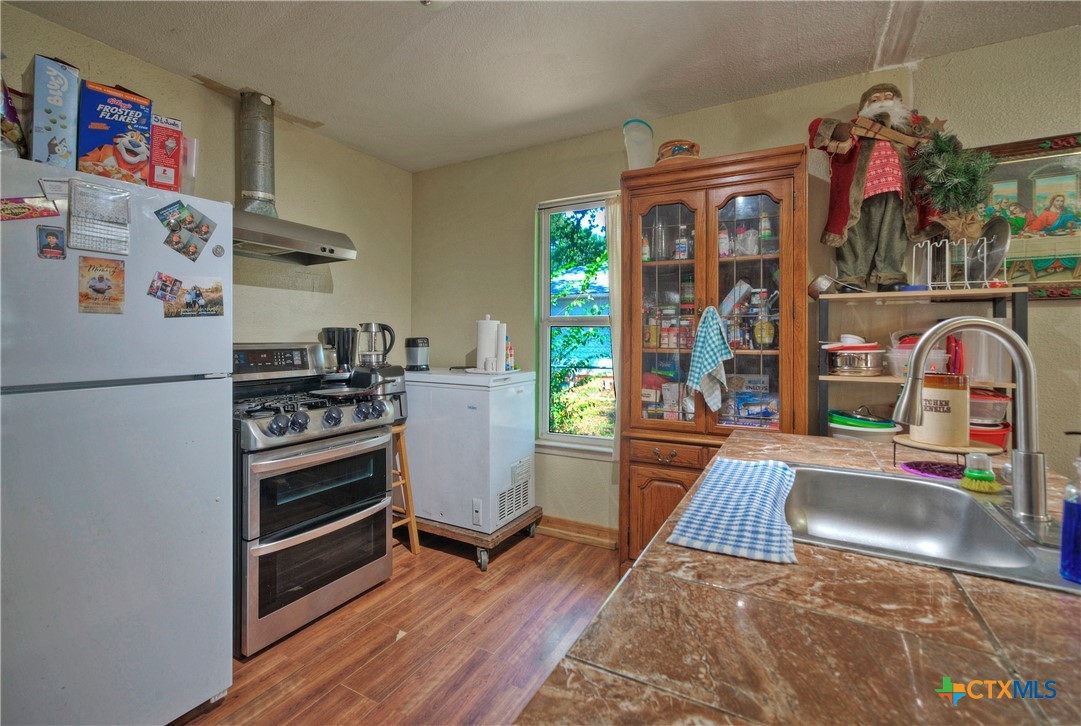 604 Vargas Road Austin, TX 78741 - Photo 16 of 25 a living room with furniture and a fireplace