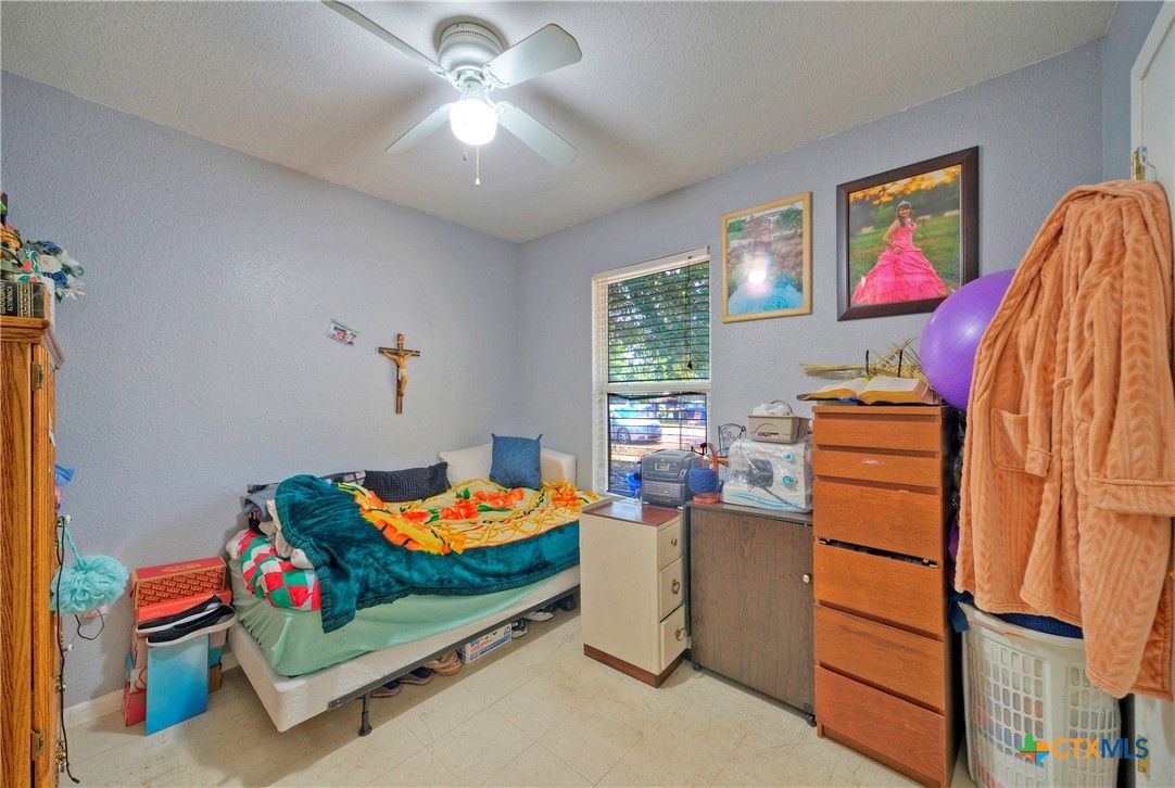 604 Vargas Road Austin, TX 78741 - Photo 20 of 25 a bedroom with furniture and a window