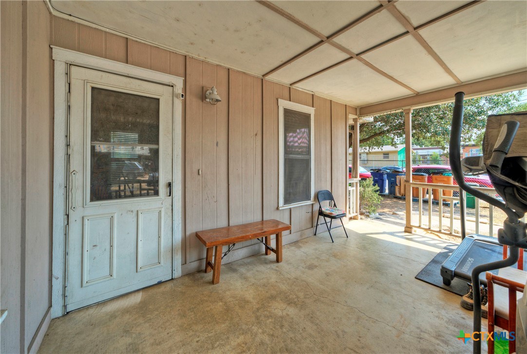 604 Vargas Road Austin, TX 78741 - Photo 9 of 25 a living room with furniture a flat screen tv and a large window