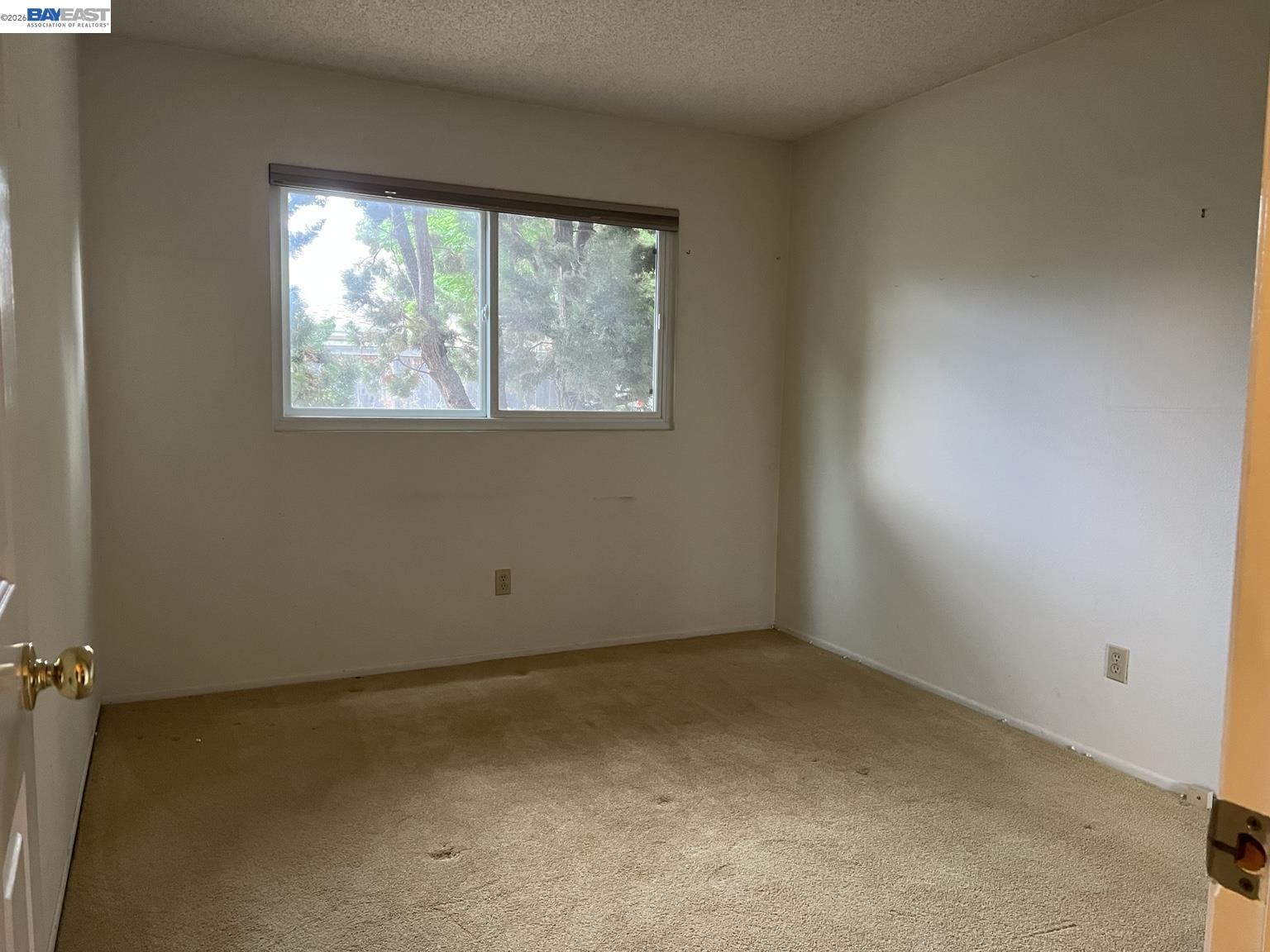 212 Puddingstone Road Alameda, CA 94502 - Photo 16 of 24 an empty room with a window