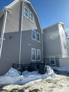 a view of a house with backyard