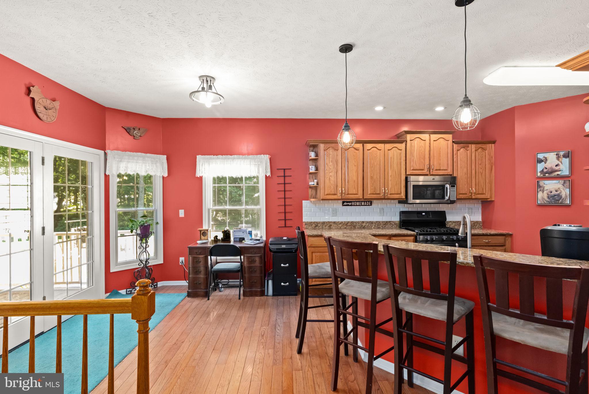 32 Hamilton Lane Elkton, MD 21921 - Photo 11 of 40 Charming kitchen with vibrant red walls.