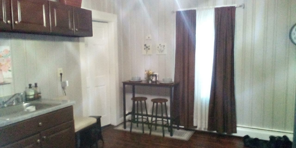 6 Elm Street Barre, MA 01074 - Photo 3 of 8 a en suite bathroom with a granite countertop sink and a mirror