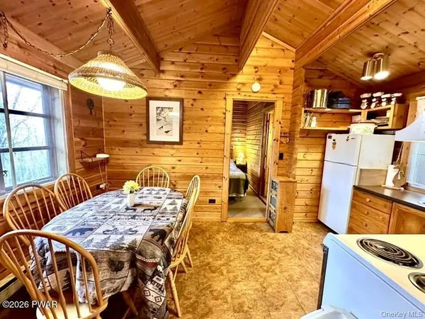 a view of a patio with table and chairs