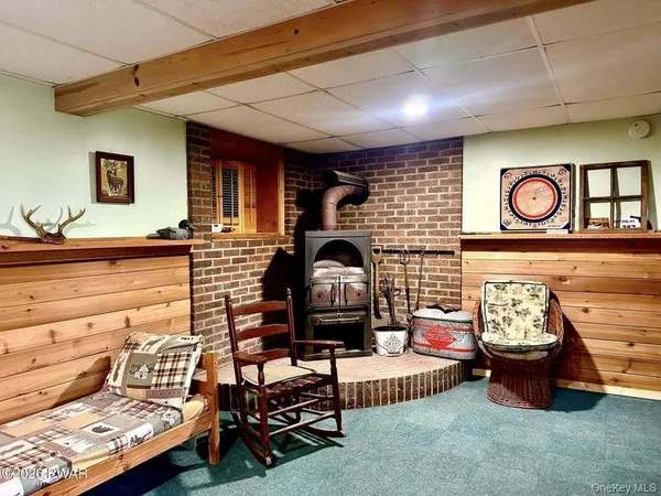 a view of a tree with wooden fence