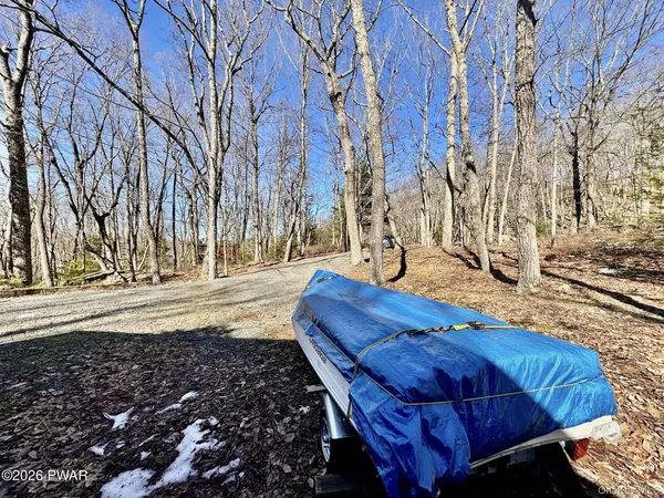 a bed room with a bed and a chair
