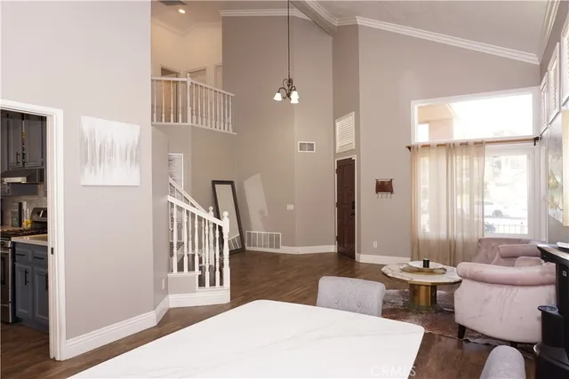 a view of a livingroom with furniture and windows