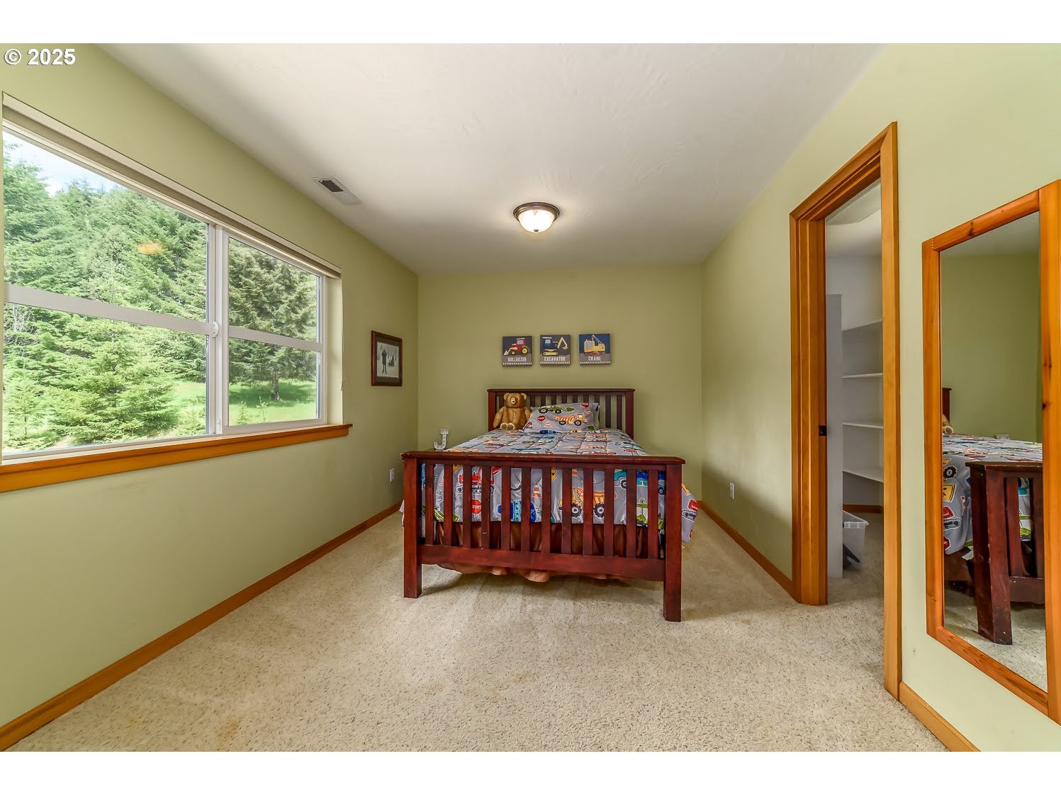 21626 Glaze Road Noti, OR 97461 - Photo 17 of 43 a bedroom with a bed and a window