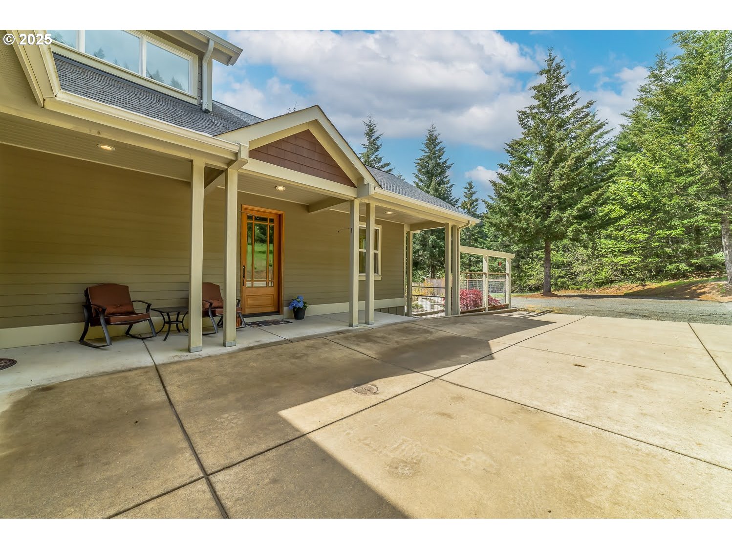 21626 Glaze Road Noti, OR 97461 - Photo 2 of 43 a view of a patio with table and chairs and potted plants