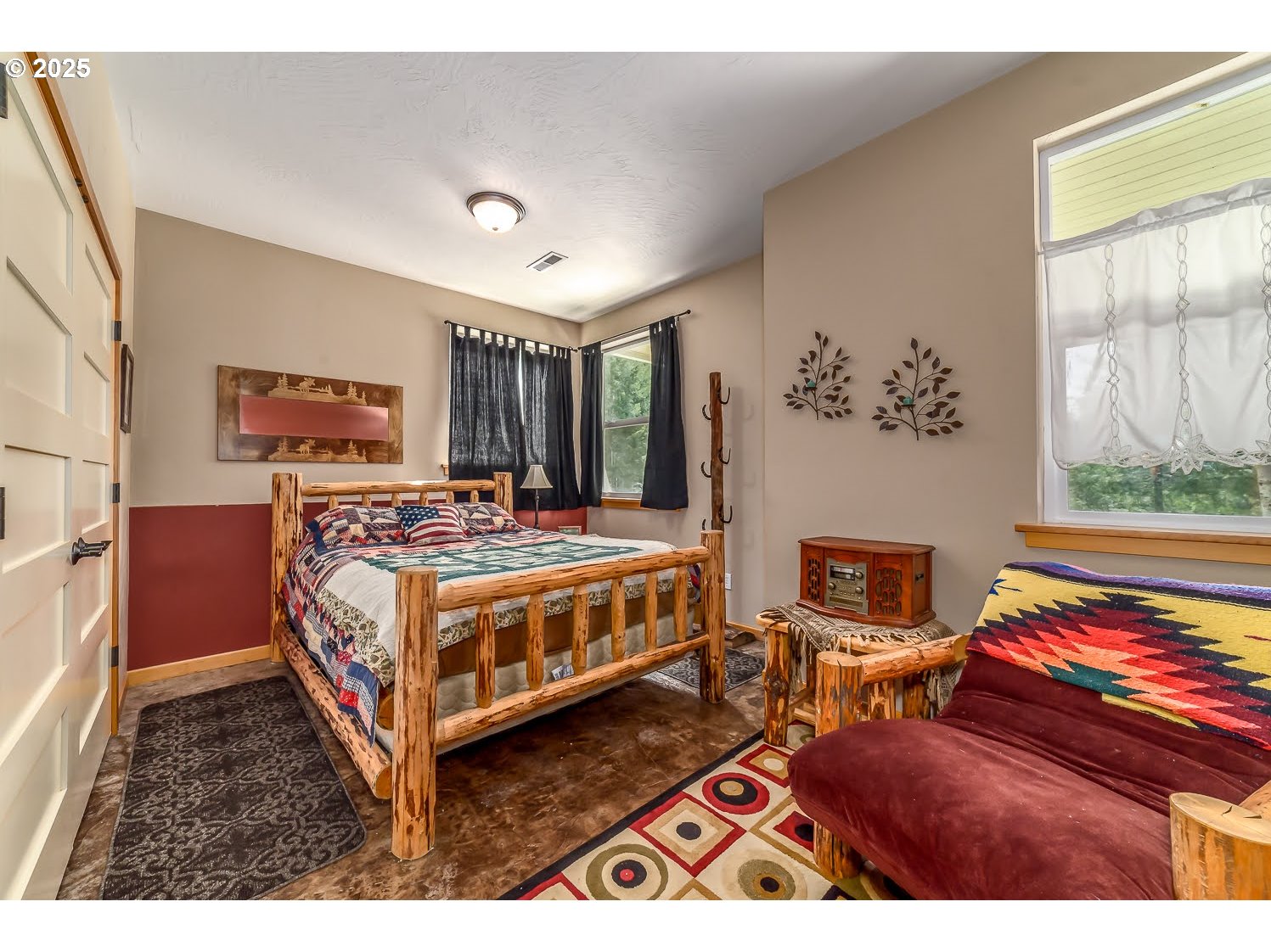 21626 Glaze Road Noti, OR 97461 - Photo 23 of 43 a bedroom with a bed wooden floor and window