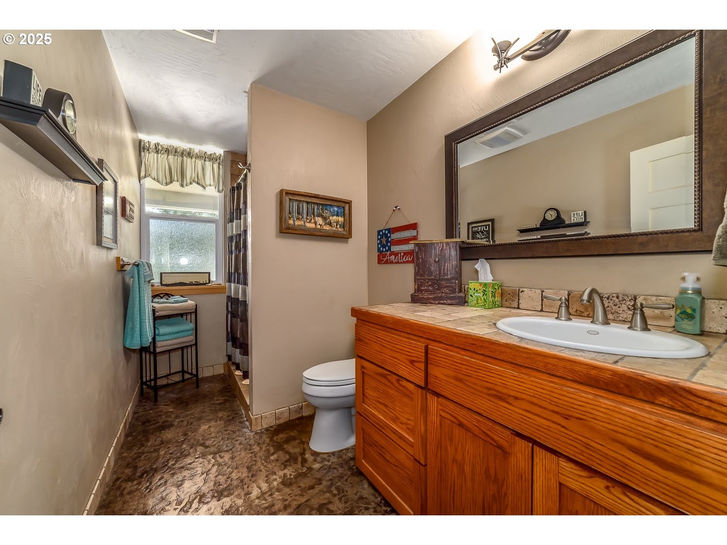 21626 Glaze Road Noti, OR 97461 - Photo 24 of 43 a bathroom with a granite countertop toilet sink and mirror