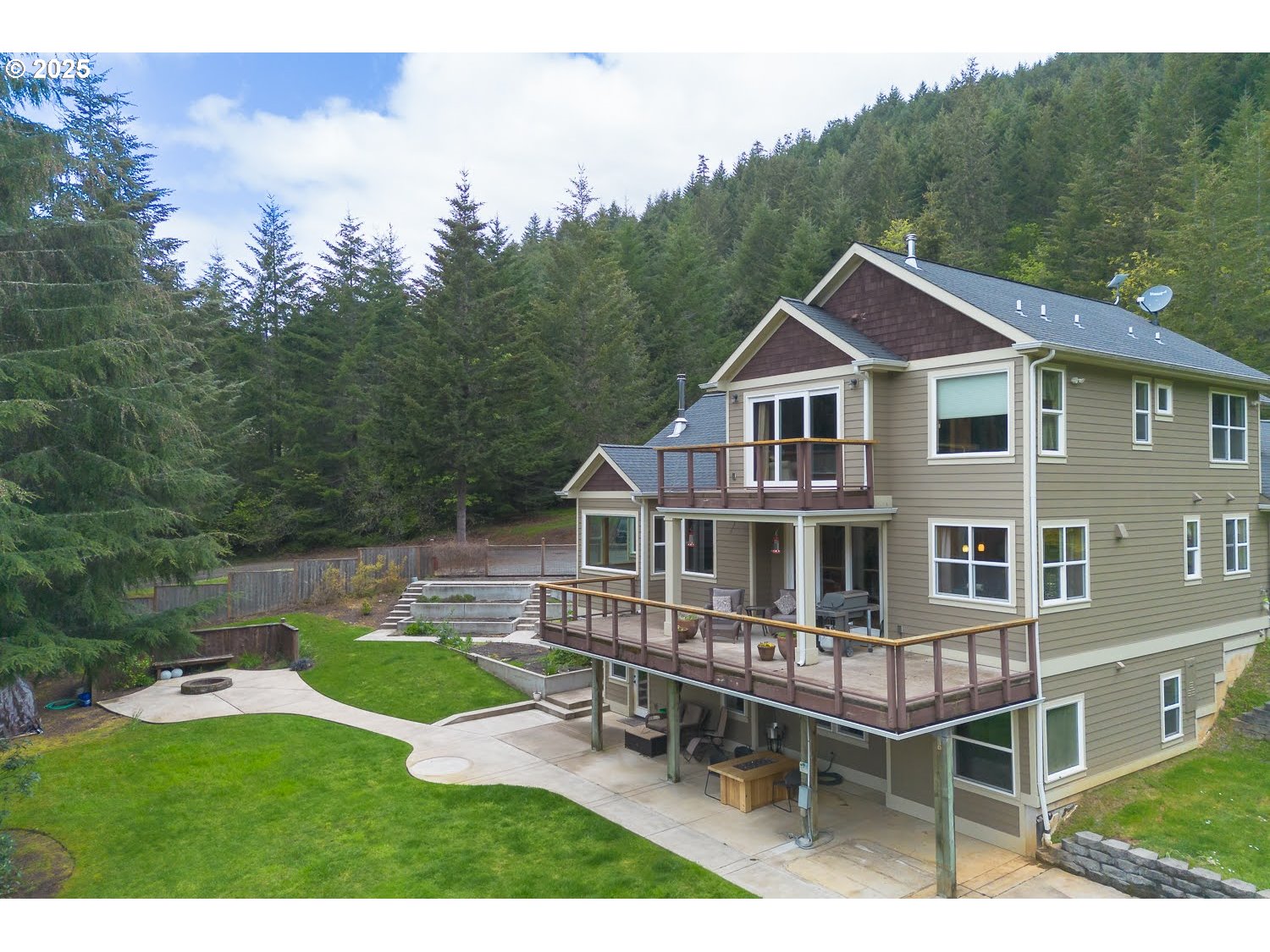 21626 Glaze Road Noti, OR 97461 - Photo 28 of 43 a aerial view of a house with a yard table and chairs