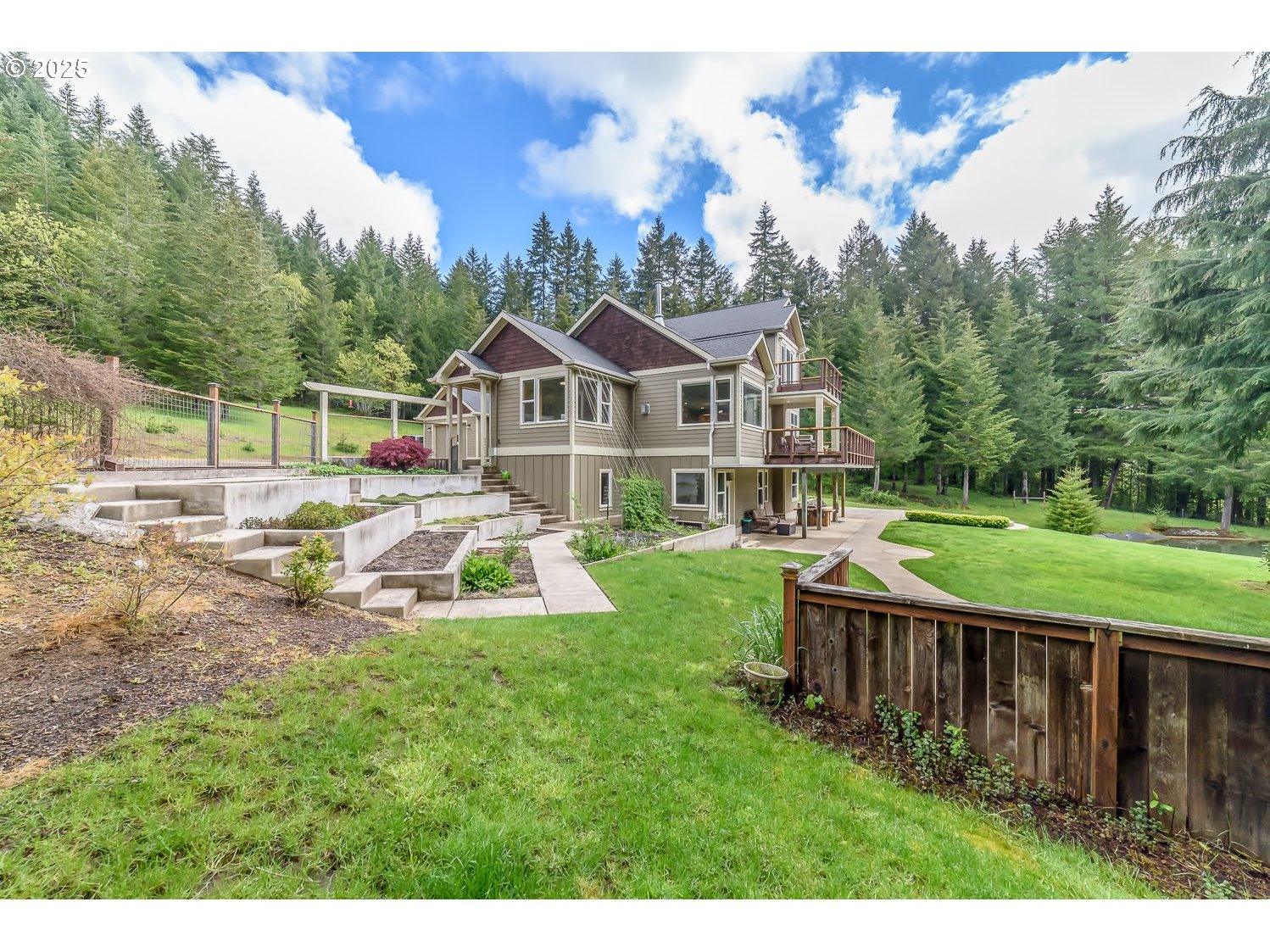 21626 Glaze Road Noti, OR 97461 - Photo 29 of 43 a view of a house with a yard and sitting area