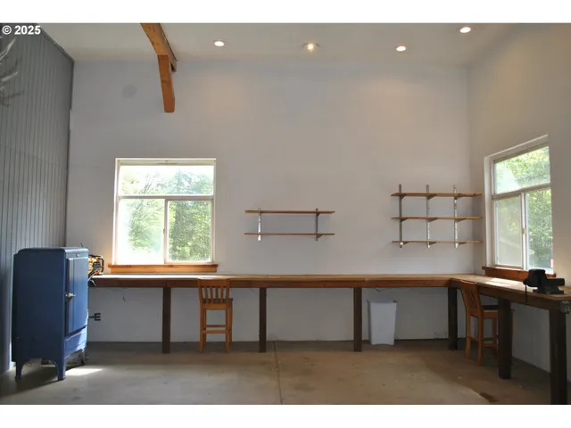 a kitchen with a window a sink and a counter