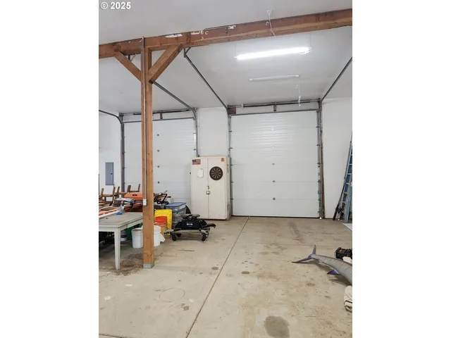 a view of storage and utility room with a window