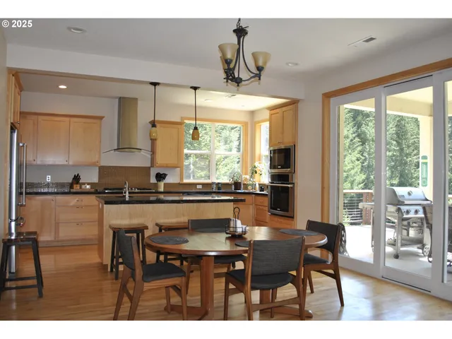 a kitchen with a table and chairs in it
