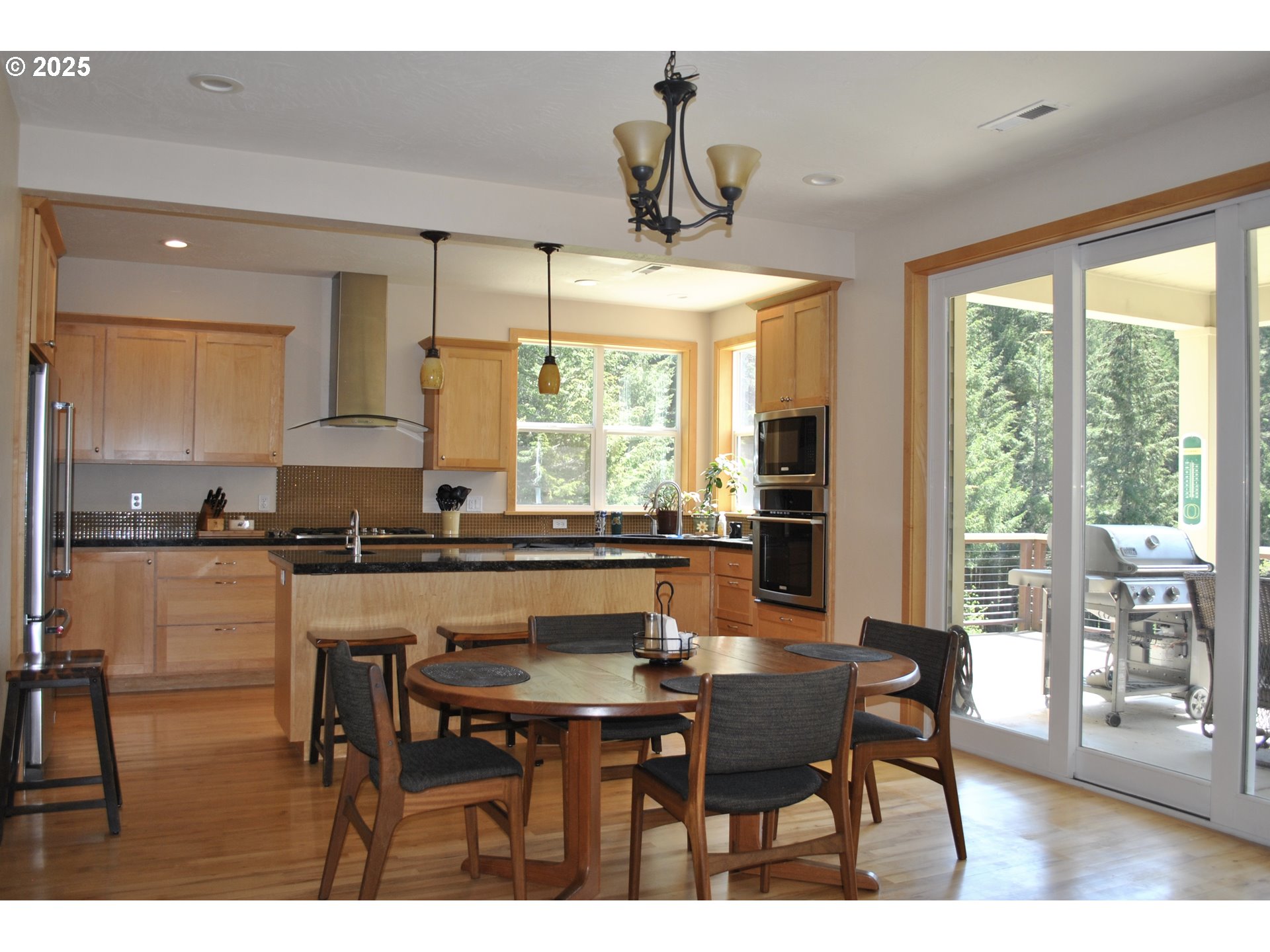 21626 Glaze Road Noti, OR 97461 - Photo 9 of 43 a kitchen with a table and chairs in it