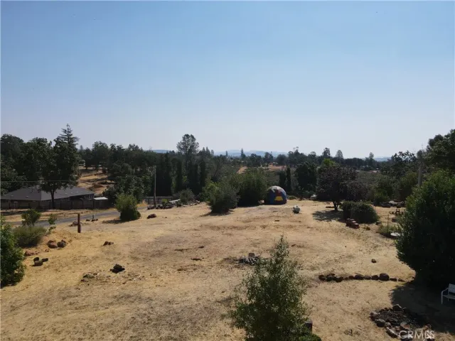 a view of a yard with snow on the road