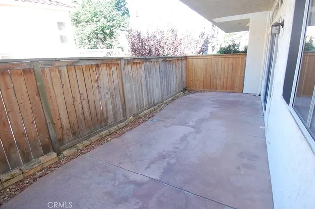 a view of balcony with wooden fence